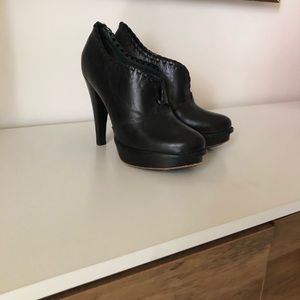 Black high heeled UGG booties